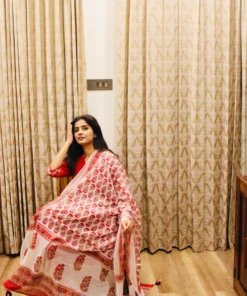 red-cotton-anarkali-suit-with-block-print-dupatta-showing-dupatta-while-model-sitting